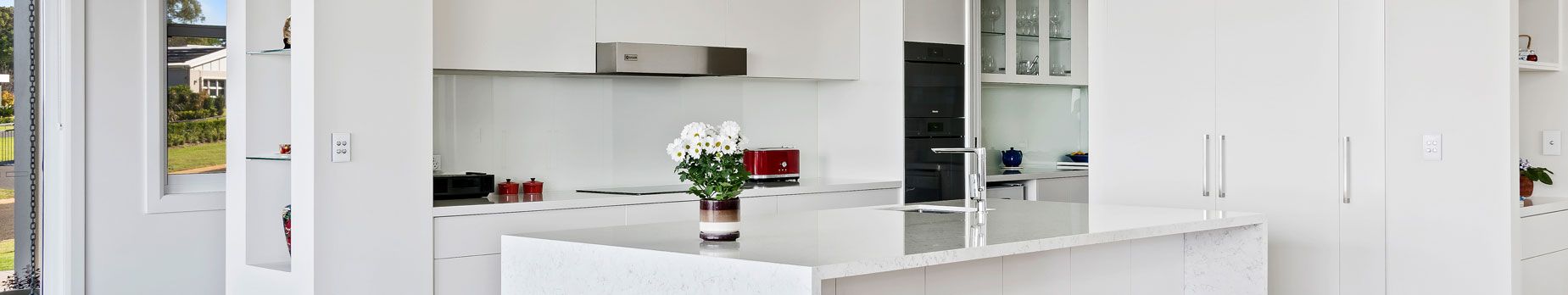 A flower vase in a kitchen counter